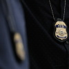 Partnerships Between ICE and Local Police Are Growing, Report Says: NPR 2 The badges of Immigration and Customs Enforcement (ICE) agents are seen as they patrol the halls of the immigration court at the Ted Weiss Federal Building in New York.