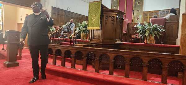 The Rev. Ronald Bell Jr. gives a sermon on Sunday at the Ashbury United Methodist Church in Washington, D.C. "I think we have learned lessons from the past. I think we are well-equipped to handle this moment," he said.