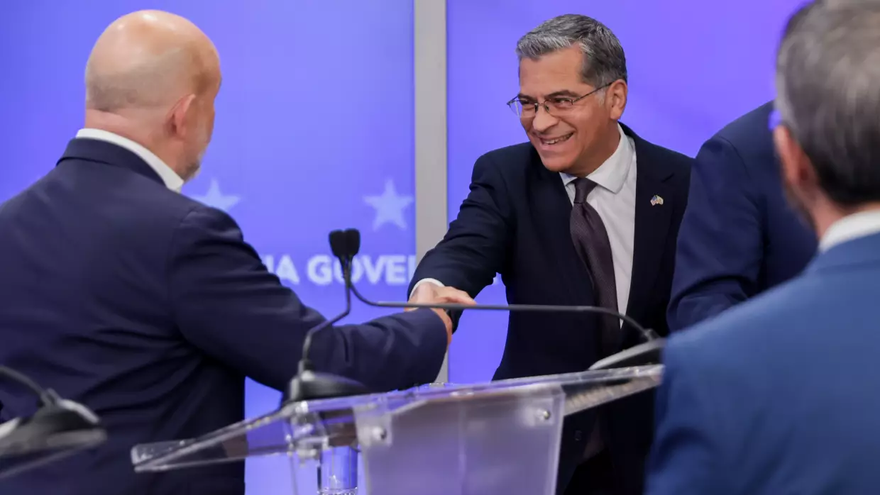 Xavier Becerra, Democratic gubernatorial candidate for California, and Steve Hilton, Republican gubernatorial candidate for California, shake hands while arriving for a gubernatorial debate at KRON Studios in San Francisco in April.