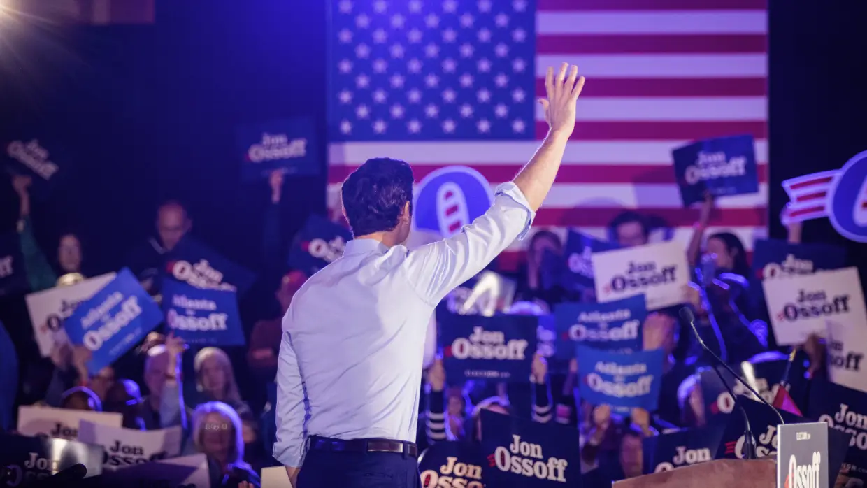 Sen. Jon Ossoff, D-Ga., waves to attendees during a reelection campaign event in Atlanta on Feb. 7.