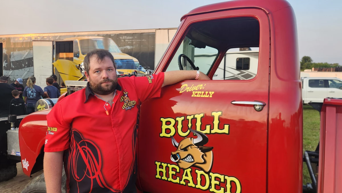 Kelly Giltinan drives the 'Bull Headed,' a pulling truck with a chrome-plated, modern engine inside a 1955 chassis.