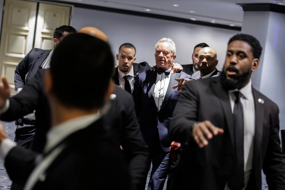 Health and Human Services Secretary Robert F. Kennedy Jr. and his wife, Cheryl Hines, are evacuated from the annual White House Correspondents' Association Dinner in Washington on Saturday.