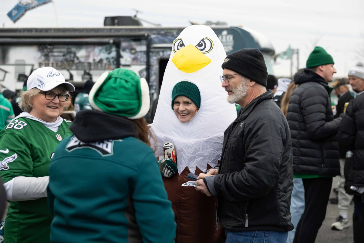 Susan Klabunde (center) dons an eagle costume at a tailgate before the NFC championship game at Lincoln Financial Field in Philadelphia.