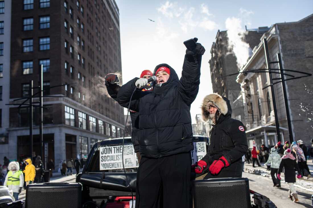 Thousands gather downtown in sub-zero temperatures as hundreds of Minnesota businesses close in a statewide “ICE Out” protest and strike against federal immigration enforcement and the expanded ICE operations in Minneapolis, Minnesota, Jan. 23, 2026. Photographed by Erin Trieb for NPR.
