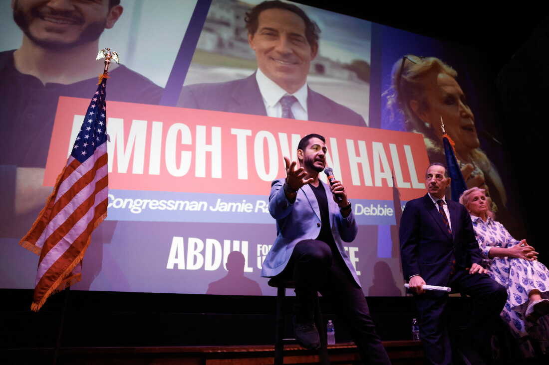 El-Sayed speaks while Rep. Jamie Raskin, D-Md., and Debbie Dingell, D-Mich., listen, during an event in Ann Arbor, Mich., on August 26, 2026.