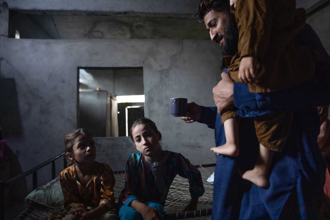 Muhammad Asif, whose children Muhammad Yaseen and Manahil tested postiive for HIV after receiving care from Valika Hospital, sits in his home on July 25, 2026 in Karachi, Pakistan. Asif's children were diagnosed with HIV after seeking treatment at Valika Hospital for a fever. "Yaseen is too young to understand. I don't know what he will think: that his father brought him to this hospital and he contracted such a fatal illness," Asif says.