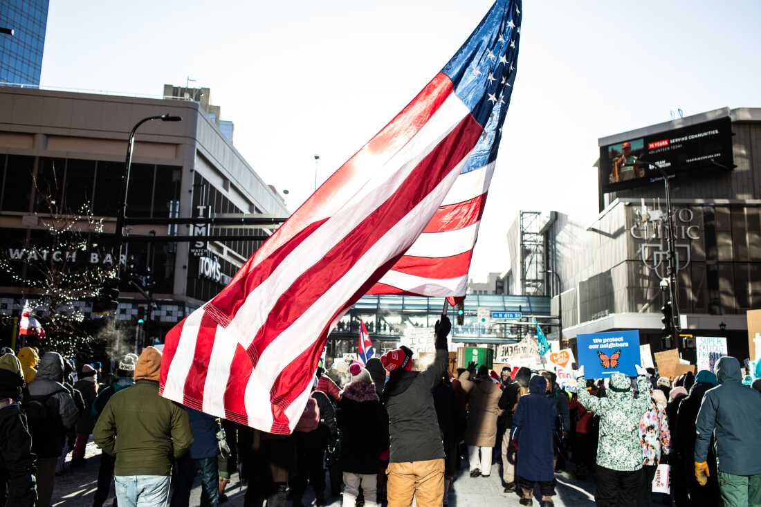 Thousands gather downtown in sub-zero temperatures as hundreds of Minnesota businesses close in a statewide “ICE Out” protest and strike against federal immigration enforcement and the expanded ICE operations in Minneapolis, Minnesota, Jan. 23, 2026. Photographed by Erin Trieb for NPR.