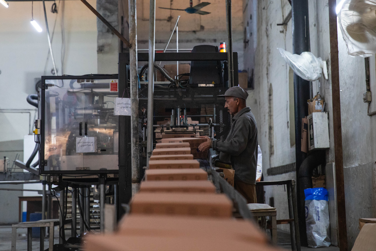 A worker with boxes in Murree Brewery's beer production facility in Rawalpindi, Pakistan. Every month, more than 1 million cans are packaged in the company's industrial brick buildings in Rawalpindi and prepared for distribution around the country.