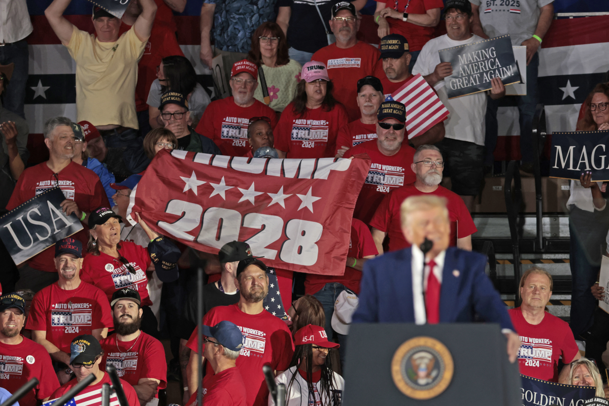 Auto Workers for Trump held up a Trump 2028 banner as Trump delivered his remarks.