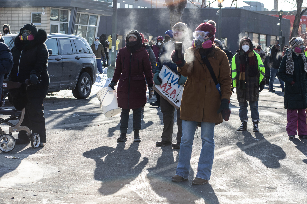 ICE and federal agents face off with Minneapolis residents and protesters following the fatal shooting of a local resident earlier in the day in south Minneapolis.