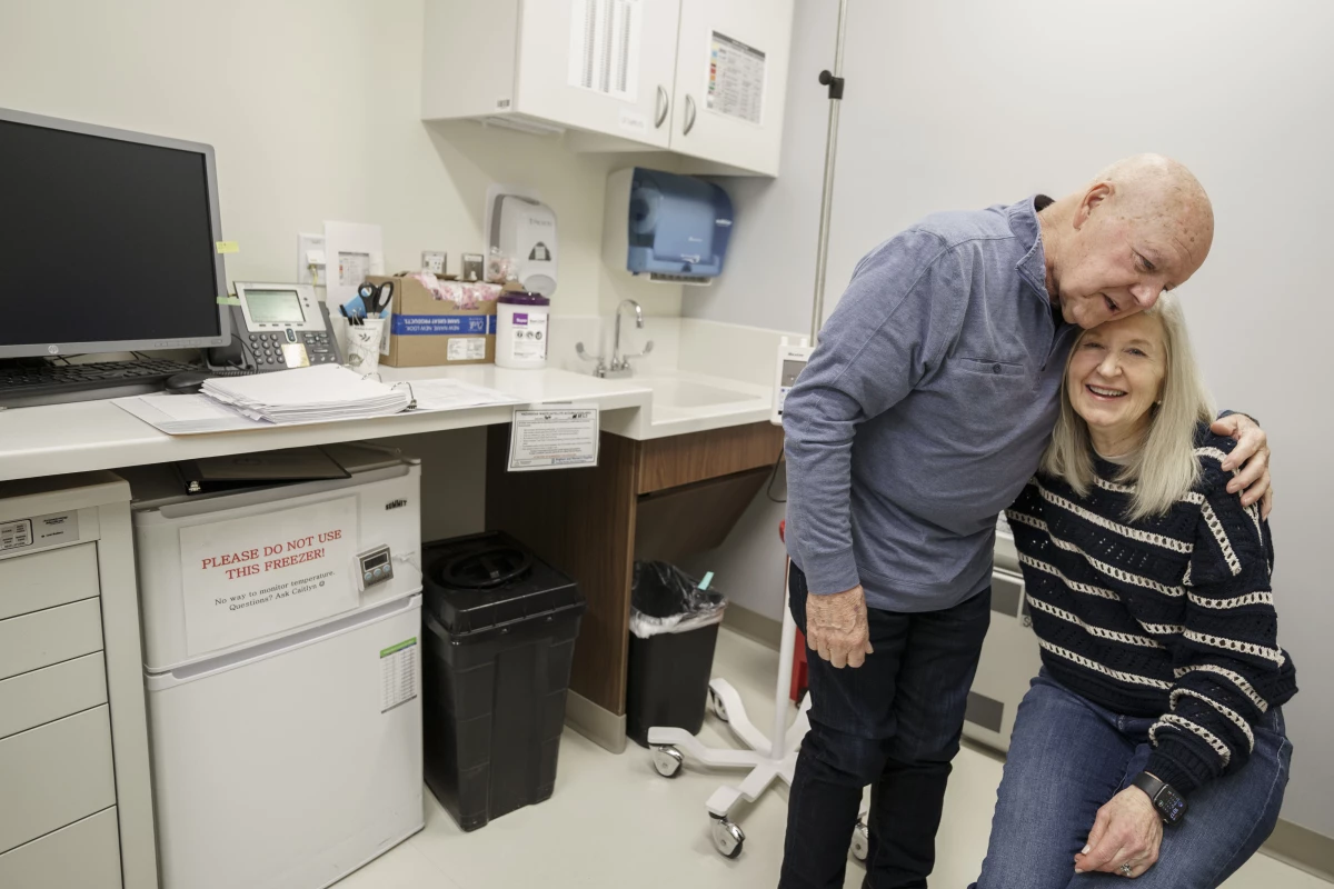 Joe Walsh, who has Alzheimer's disease, is accompanied by his wife, Karen Walsh, to an appointment at Mass General Brigham Hospital in Boston. Joe is receiving an experimental therapy to treat Alzheimer's.