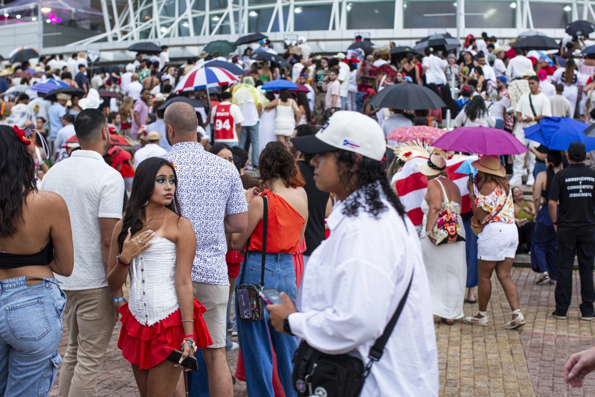 People wait outside San Juan's Jose Miguel Agrelot Coliseum, known as 'El Choli', before a recent Bad Bunny concert.