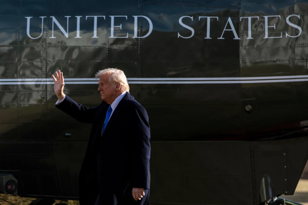 President Trump walks on the South Lawn of the White House before boarding Marine One in Washington, D.C., on Friday.