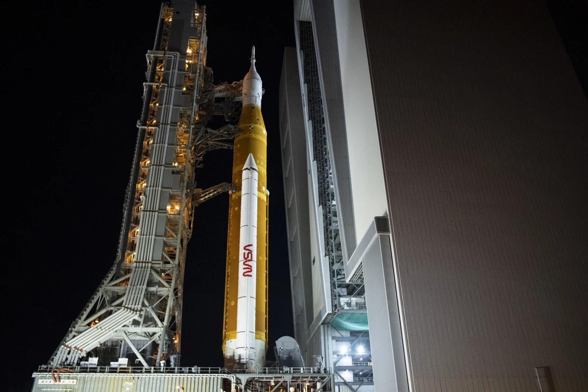 NASA's Space Launch System (SLS) rocket, with the Orion spacecraft aboard the mobile launcher as it rolls out of the Vehicle Assembly Building to Launch Pad 39B, on Nov. 3, 2022, at Kennedy Space Center at Cape Canaveral, Fla., in preparation for a launch.