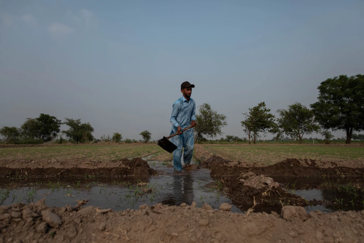 A man works in a field in an agricultural community near the Ravi River, one of the three rivers allocated to India under the Indus Waters Treaty, on June 6 in Lahore, Pakistan.
