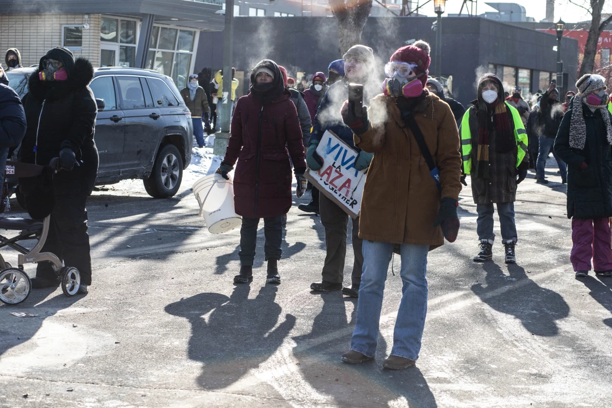 ICE and federal agents face off with Minneapolis residents and protesters following the fatal shooting of a local resident earlier in the day in south Minneapolis.