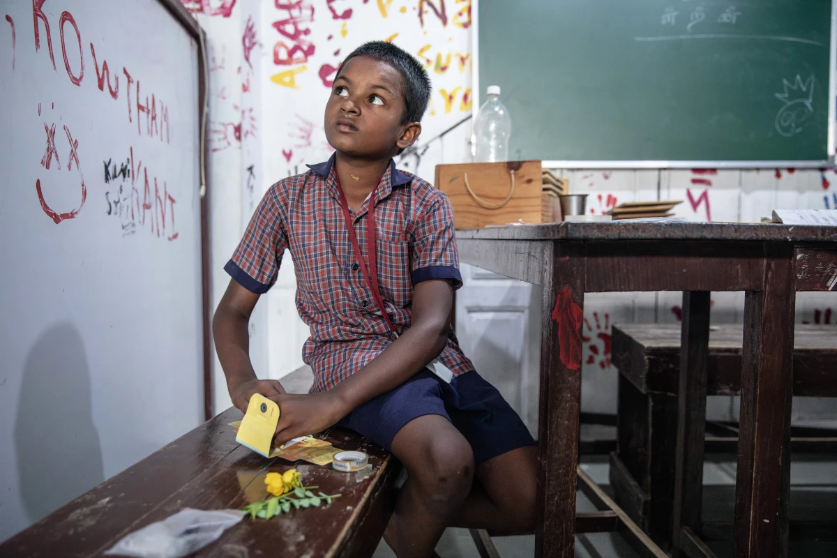 S. Hariraj, 8 years, assembles his foldscope. 'The Foldscope taught me that the world we see around us can be very different than what we assume,' he says. 'It's like having a third eye.'