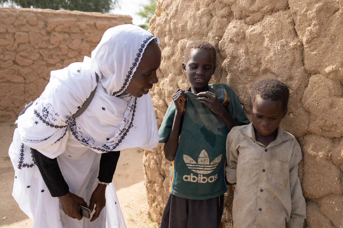 Maqboula Ahmad Adam, a Sudanese refugee who volunteers with World Vision, says she checks in on Mahamat and his brothers a few times a week. 'But the only thing we can do is call them to the child-friendly spaces and provide counseling and advice on how to be safe from the rain and the collapsing huts,' she says.