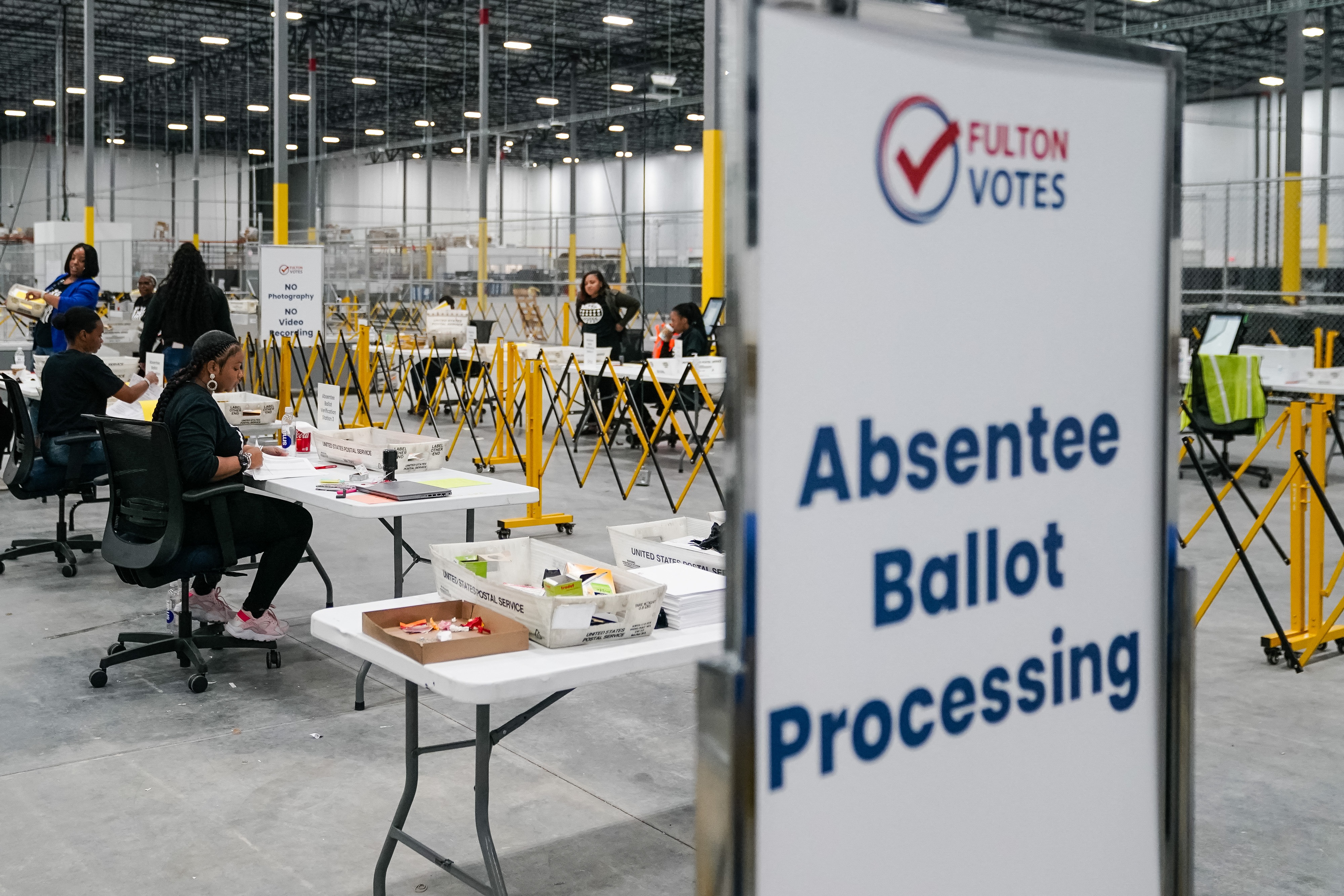 Fulton County election workers process absentee ballots on Nov. 4, in Union City, Ga. (AFP via Getty Images)
