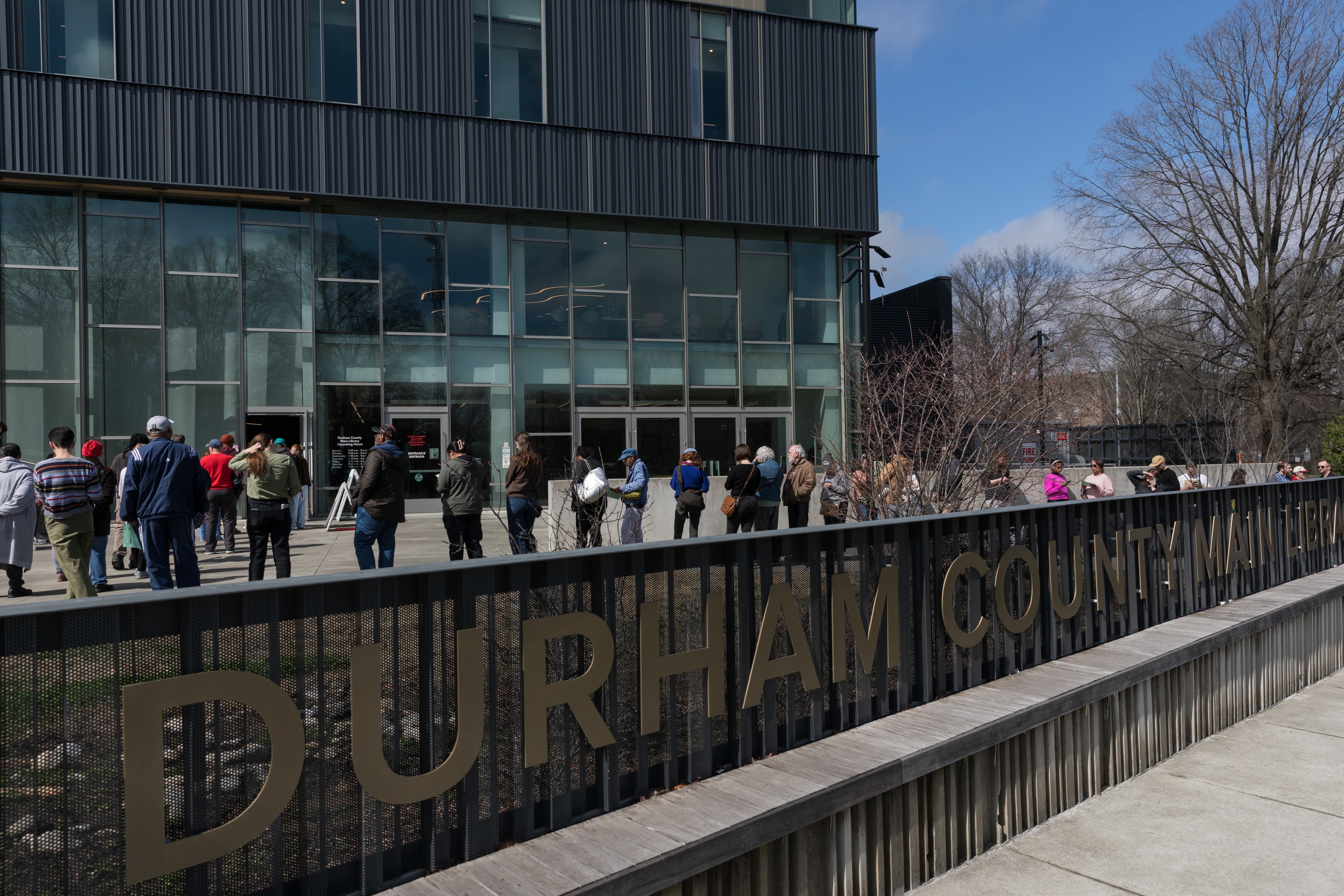 Voters wait in line to cast their ballots at the Durham County Main Library on the last day of early voting in the North Carolina primary election in Durham, North Carolina on Feb. 28, 2026.
