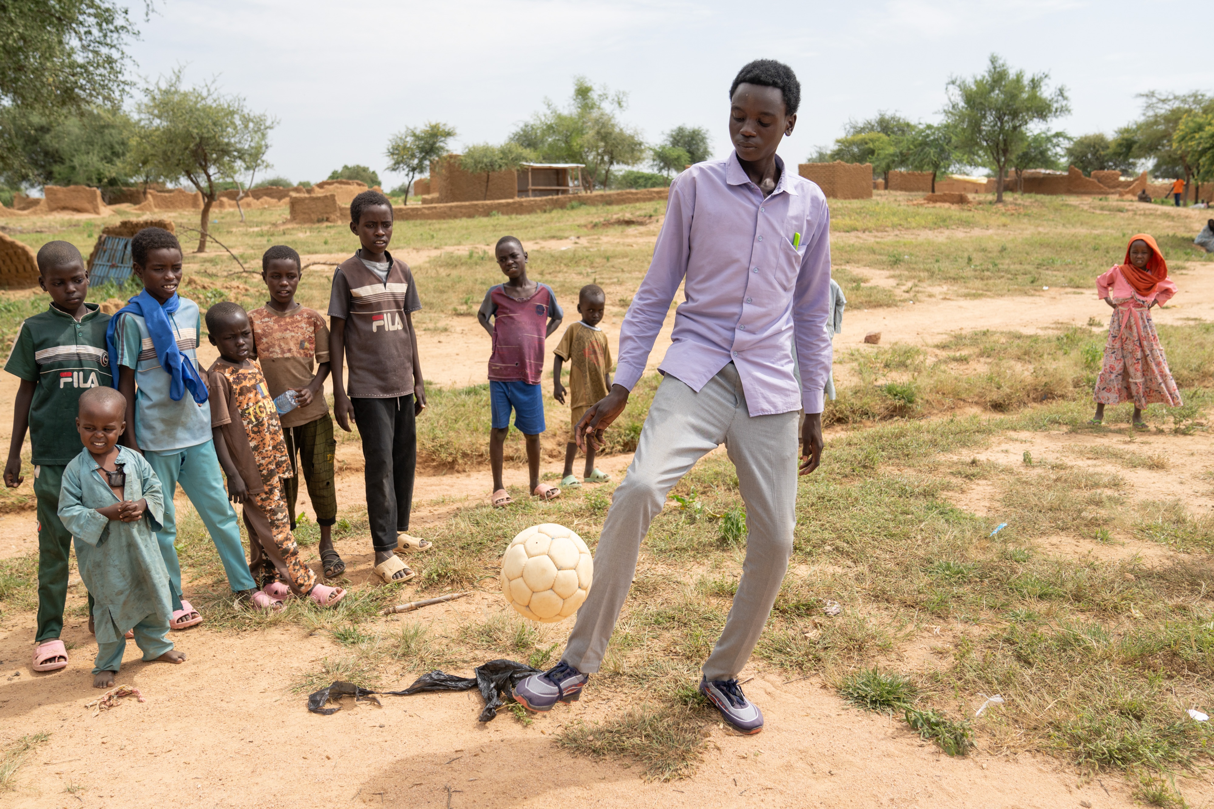 Mahawat Zakaria Jouma is happy when he gets a chance to play soccer, but mostly he is busy taking care of his siblings, trying to earn money makeing bricks, and going to school.