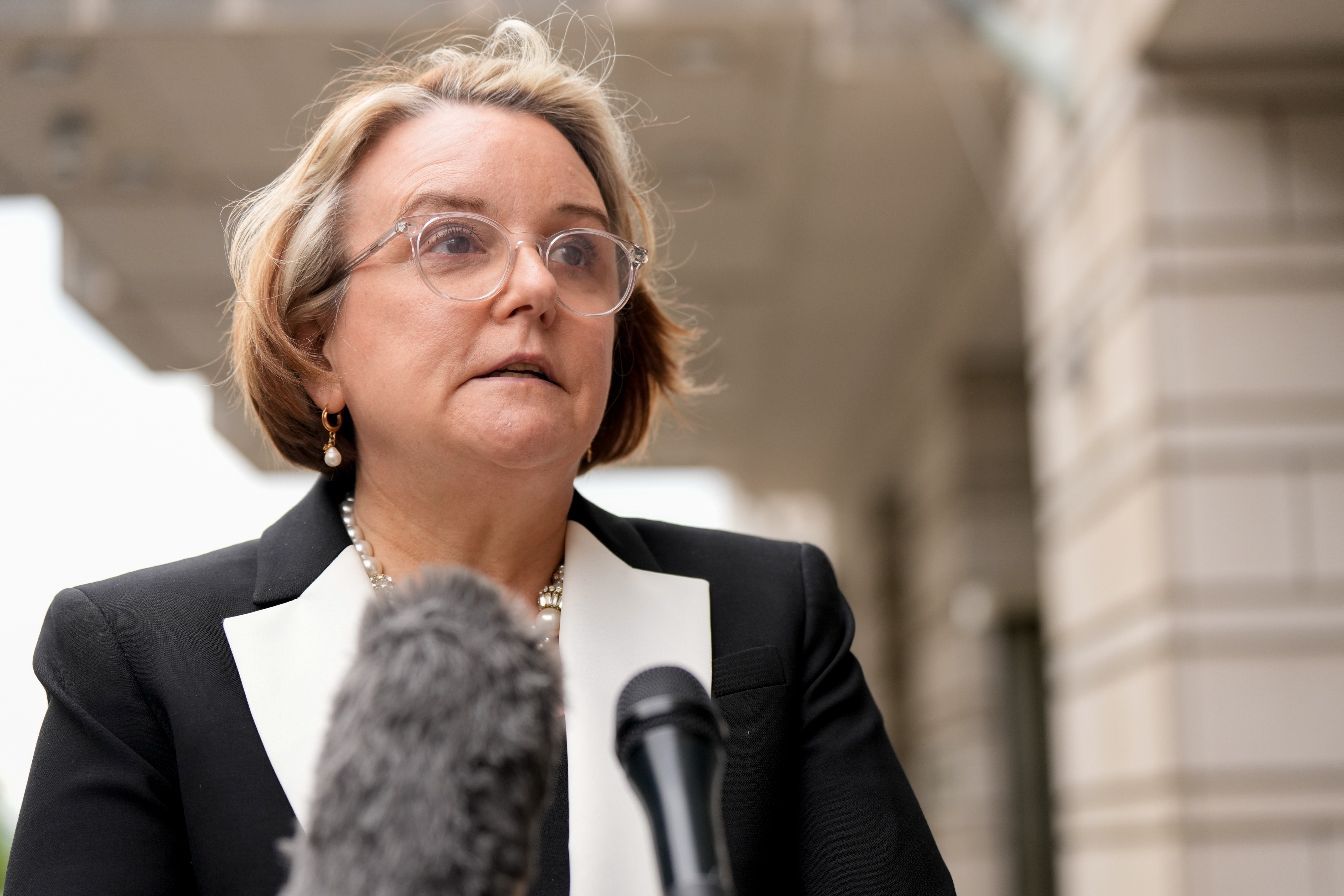 Abigail Slater, US assistant attorney general for the Antitrust Division, speaks to members of the media outside federal court in Washington, DC, US, on Monday, April 21, 2025. Google will square off against the Justice Department and dozens of state attorneys general in a Washington court room over what changes the judge will order to prevent the company from monopolizing the online search market.