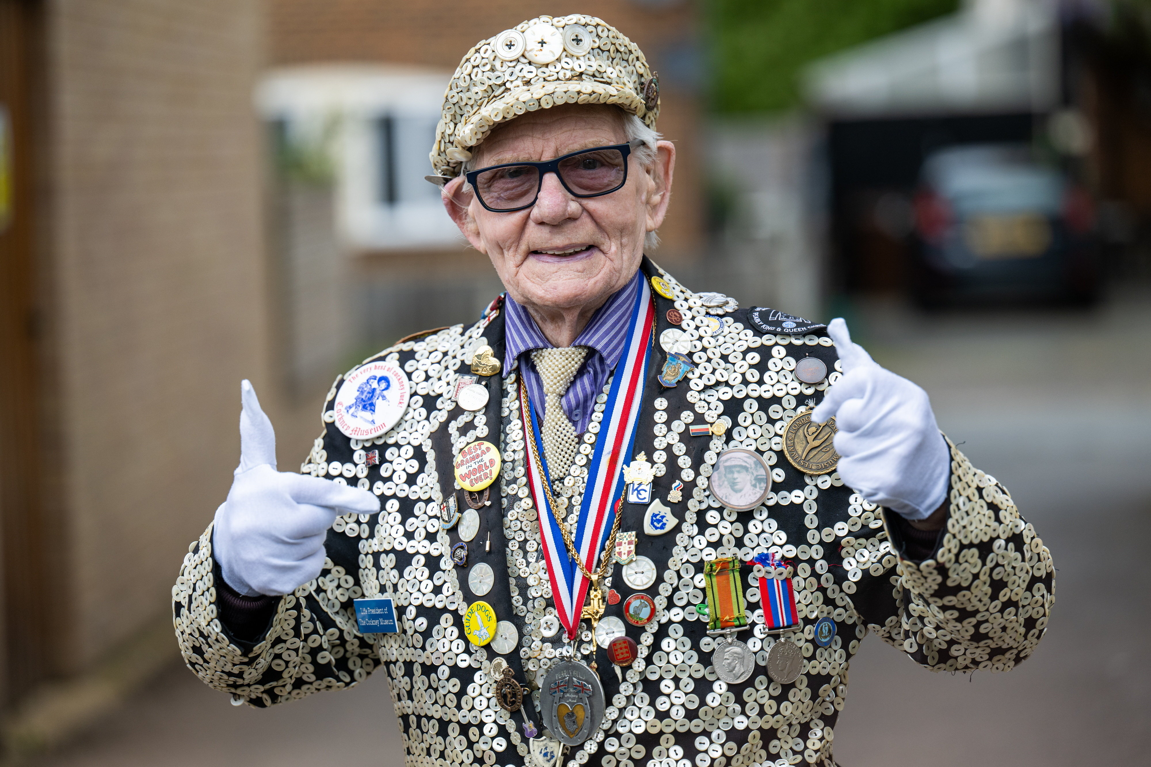 George Major, known as the Pearly King of Peckham, wears his blinged-out suit in 2024. He died in August at age 88.