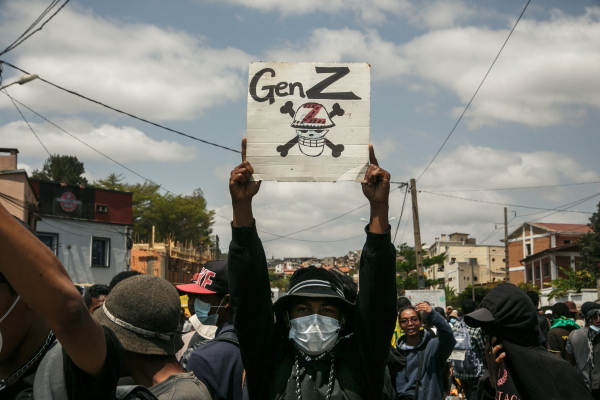 A protester holds a placard during a demonstration against repeated water and electricity outages in Madagascar.