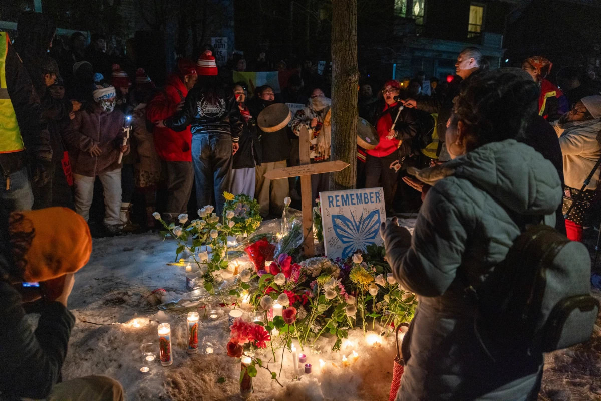 Community members pray during a vigil following a fatal shooting by an Immigration and Customs Enforcement (ICE) agent in Minneapolis, Minnesota, US, on Wednesday, Jan. 7, 2026. Since the shooting and protests community members have been scared to leave their homes.