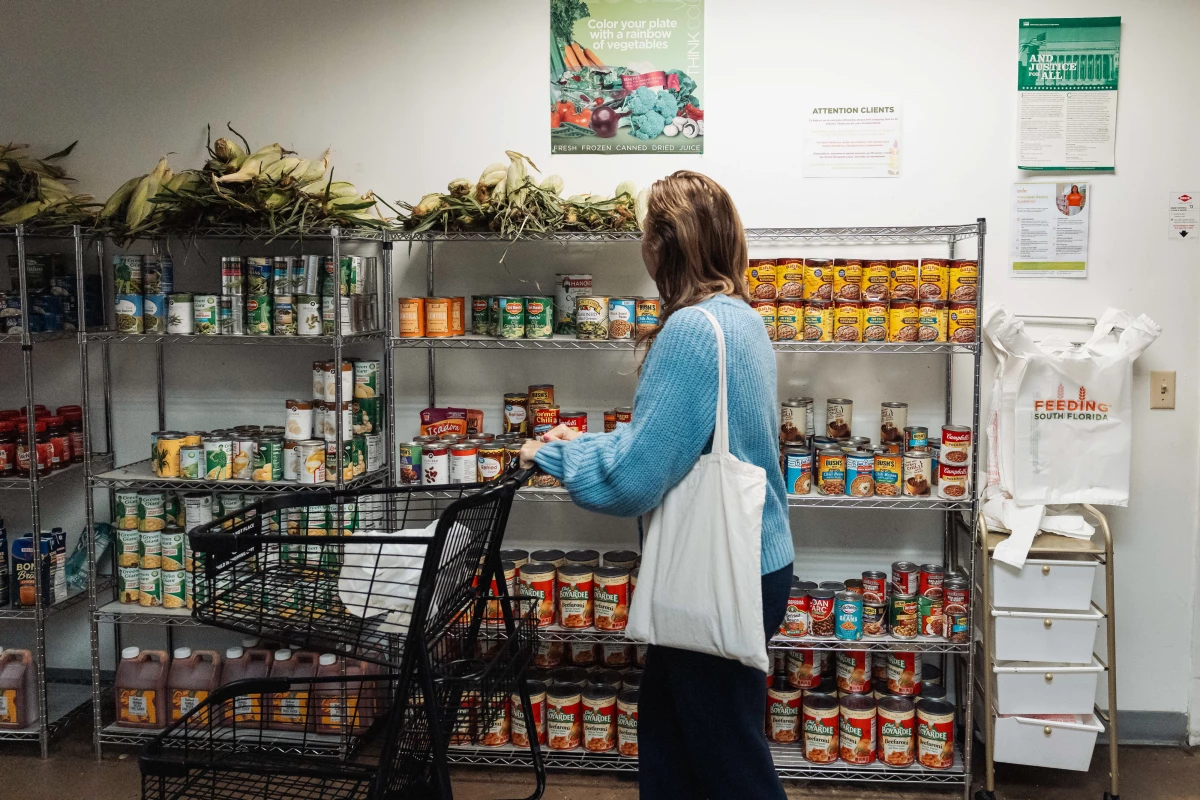 A resident browses donated food items in the pantry at Feeding South Florida in Pembroke Park, Florida, US, on Friday, Oct. 31, 2025.