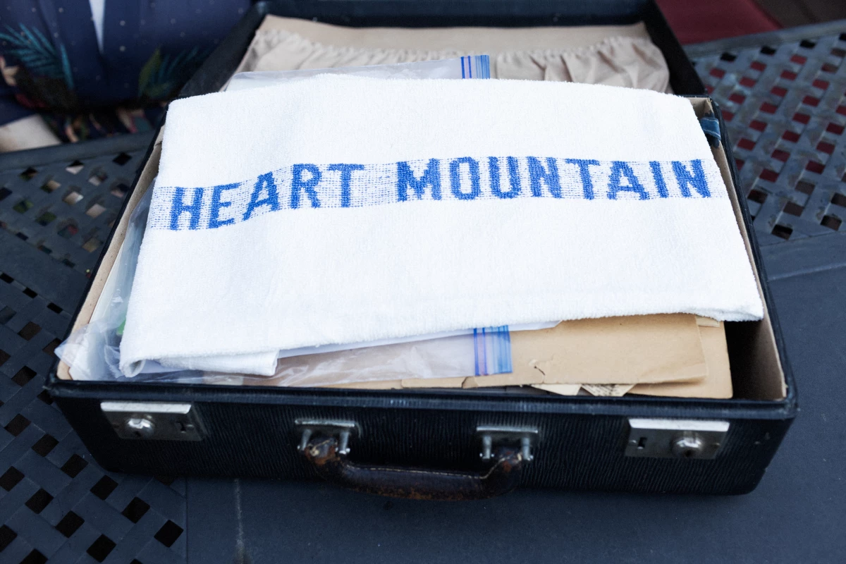 Horikawa and her family were sent to an internment camp in Wyoming during World War II. Her mother kept a trunk of artifacts from their stay under her bed, and Horikawa has only opened it a couple of times. The monogrammed towel reads 'Heart Mountain,' where the camp was located.