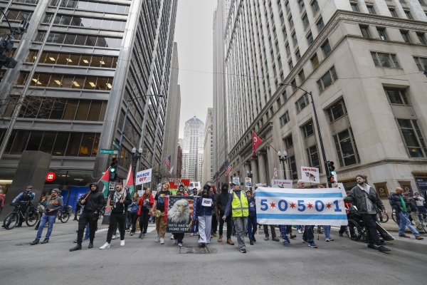 Demonstrators gather during the "day of action" protest in downtown Chicago, Illinois.