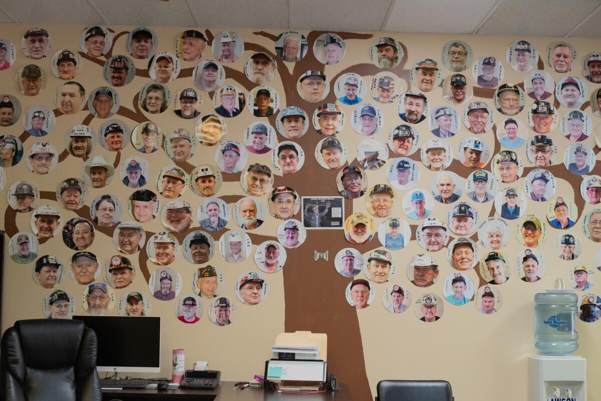 A wall in the New Beginnings clinic shows many of the coal miners who've been treated there. Respiratory therapist Marcy Freeman also has a collection of funeral programs for those who've died.