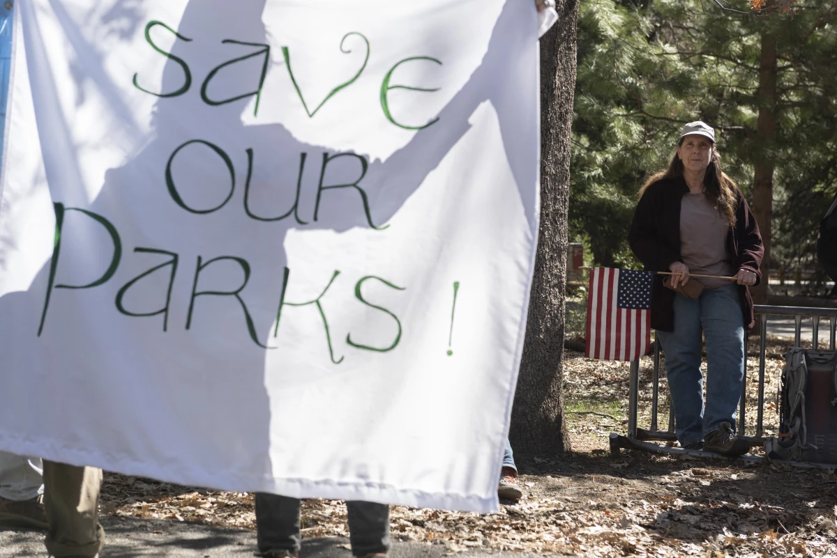 People demonstrate during a protest against federal employee layoffs at Yosemite National Park, California on March 1, 2025. Many workers at the U.S. Department of Interior and other agencies are being reinstated following court orders.