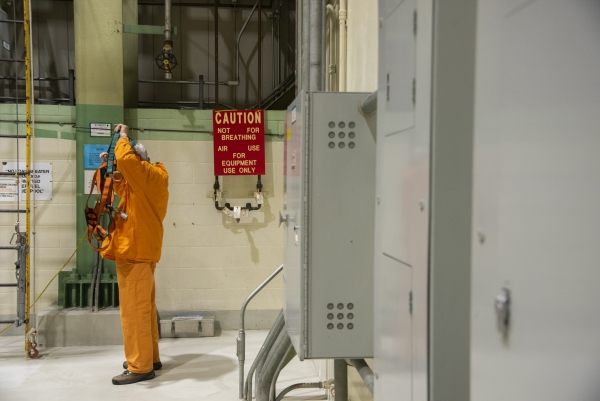 A worker places dons safety equipment at the Peach Bottom nuclear plant in Delta, Pennsylvania, U.S., on Tuesday, Feb. 19, 2019. The NRC sets radiation safety standards for nuclear workers and the public.