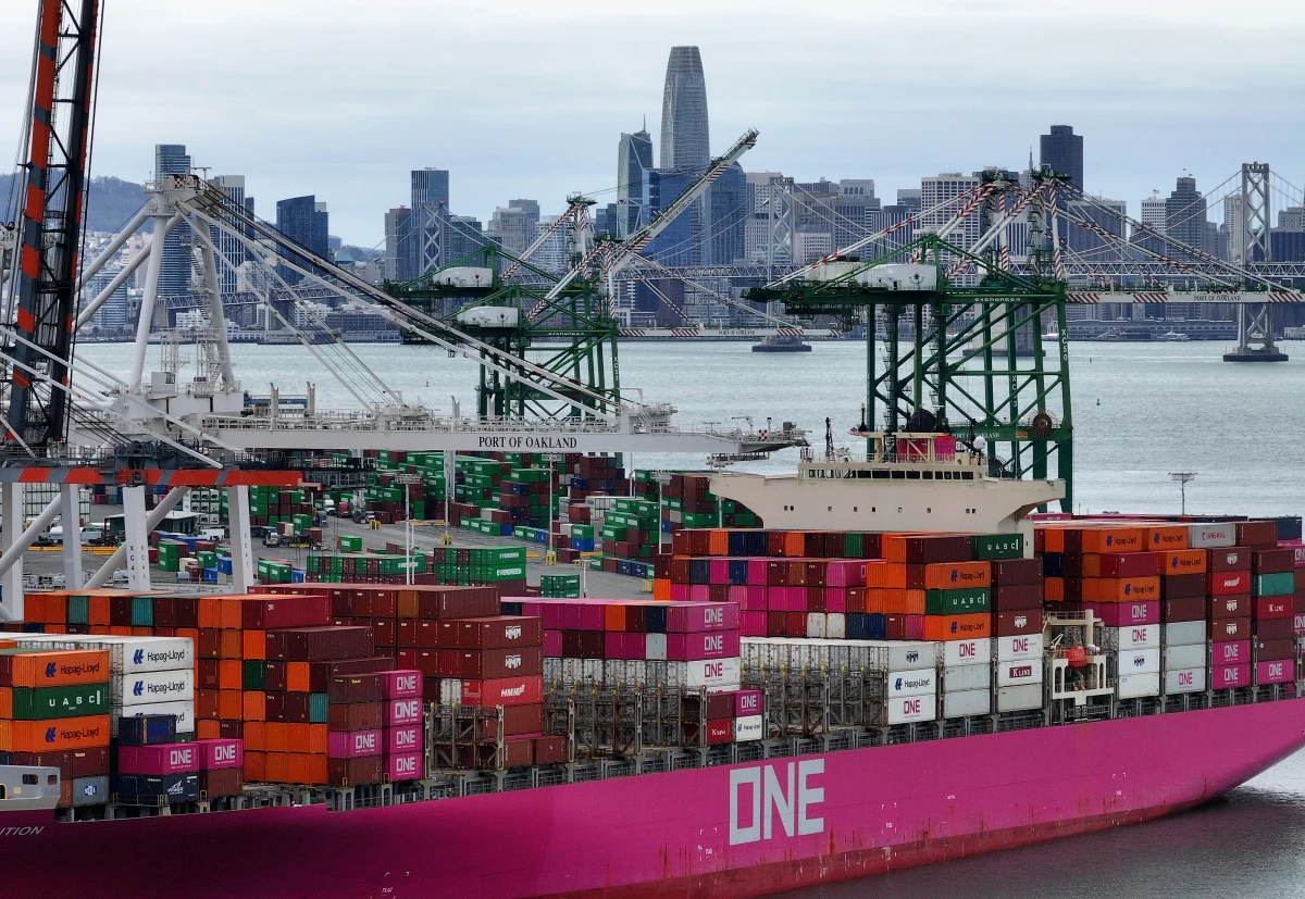 A container ship is docked at the Port of Oakland in California on Monday. Trump has enacted 10% tariffs on goods from China.