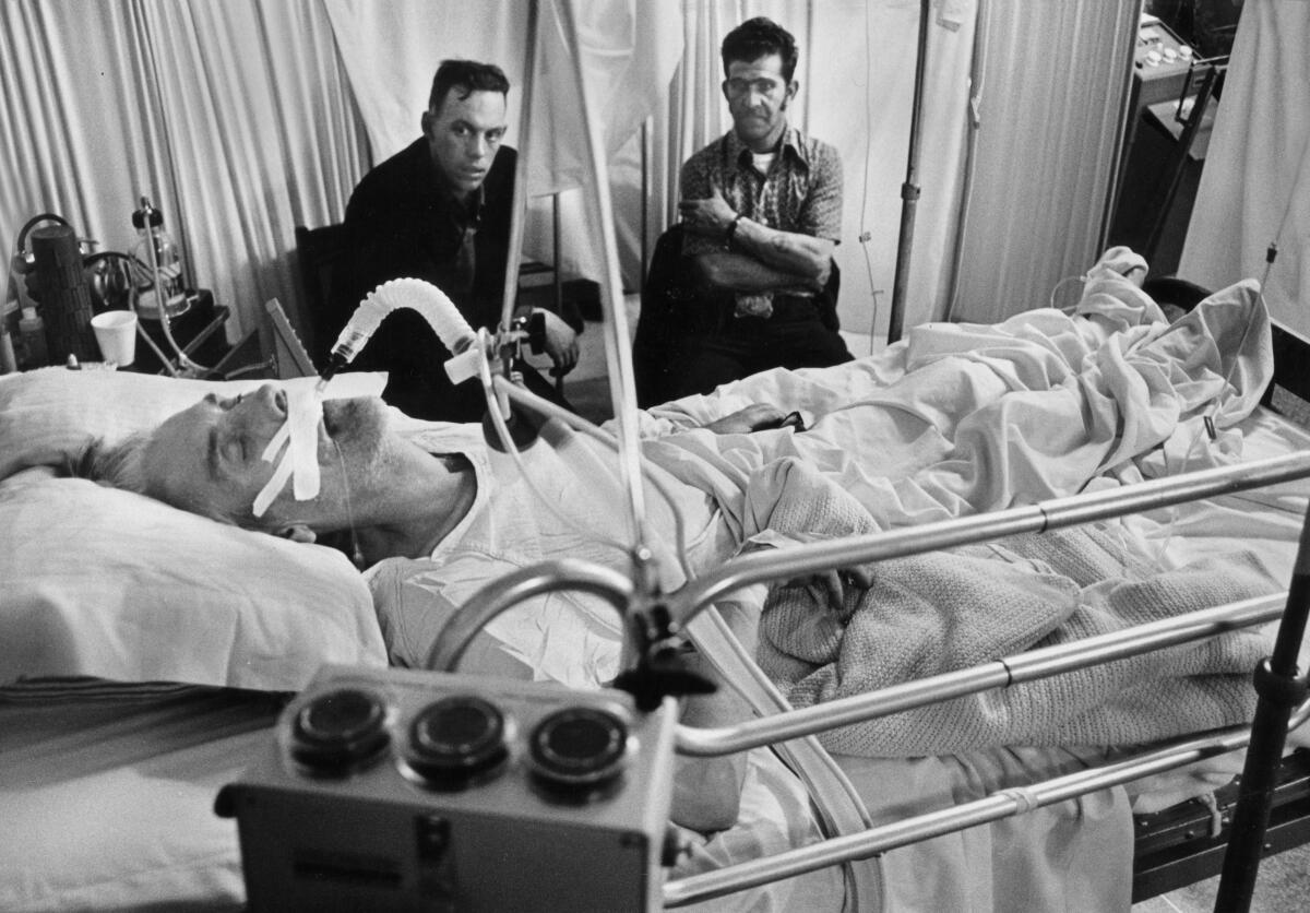 Coal miner Jess Bishop near the end of his life, with his sons, both coal miners. Bishop died of black lung disease in 1976, just before Congress passed tough new limits on exposure to the coal mine dust that causes the disease.