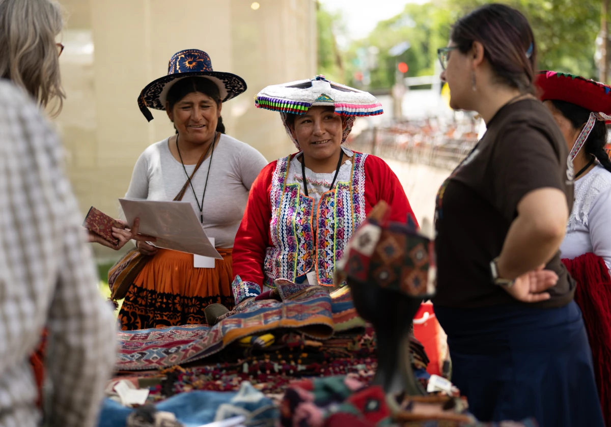 Master weavers from Peru wear their creations as they demonstrate the art of weaving at the Folklife Festival.