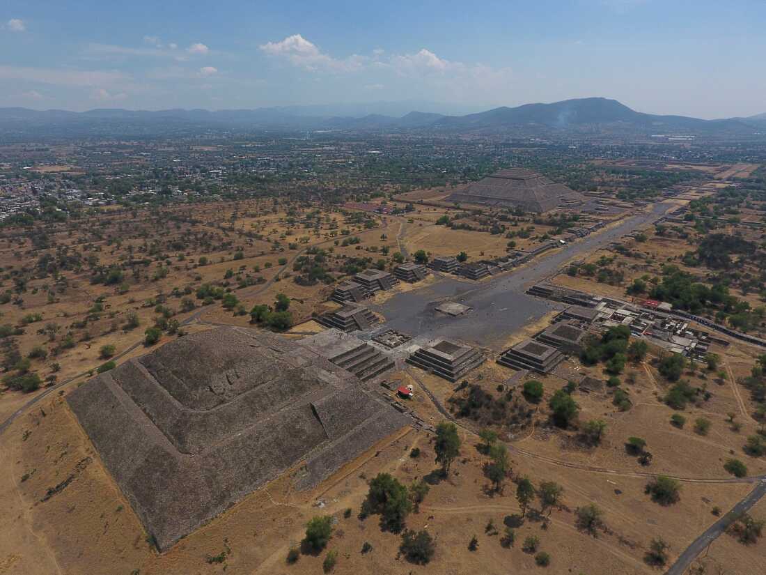 The Pyramid of the Moon, left, and the Pyramid of the Sun, rear right, are seen along with smaller structures lining the Avenue of the Dead in Teotihuacan, Mexico, on March 19, 2020.
