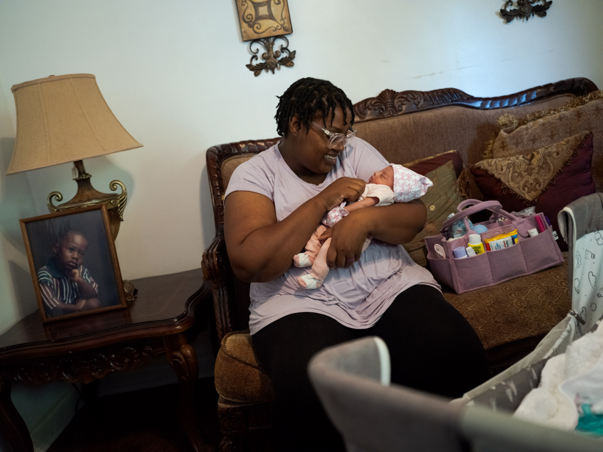 Carlnishia Kimber Holmes holds her newborn daughter, Kaomi, at their home in Greenville, Miss. Following a high-risk pregnancy Kaomi was born by emergency cesarean section weighing four pounds five ounces. She spent a week in a neonatal intensive care unit and is now healthy.