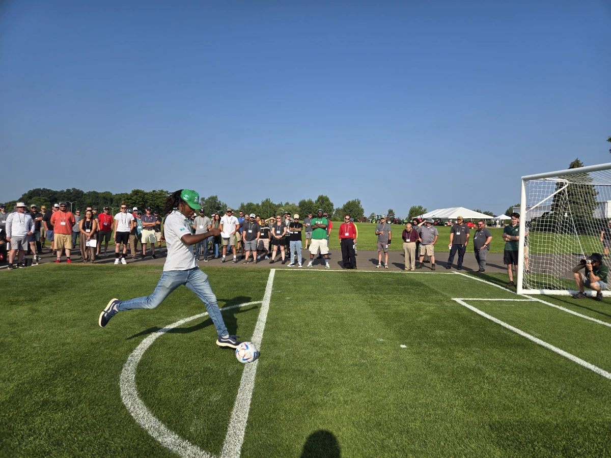 In August 2024, Michigan State University researchers give people a chance to try out shooting soccer balls on a field with different modifications during 2024 Turfgrass Field Day