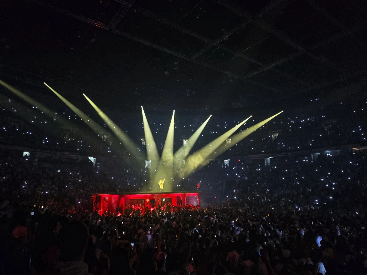 Bad Bunny atop a typical Puerto Rican house that was built onto the arena floor for his 30-concert residency.
