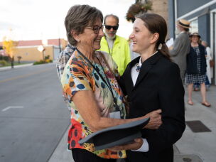 Melissa Talmadge Cox (left), Keaton's granddaughter, hugs Chloe Fadem.