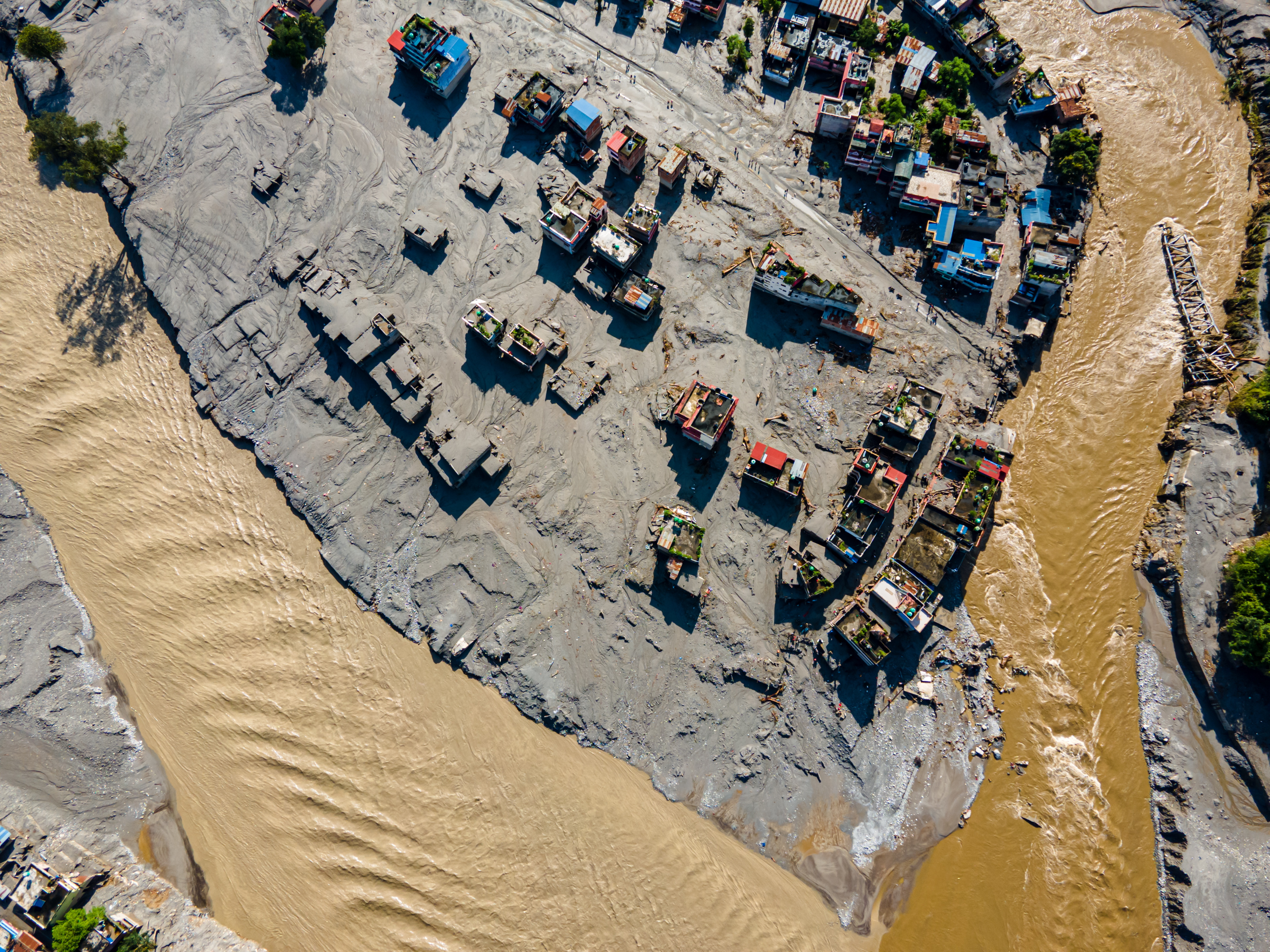 An aerial view shows the aftermath of flooding along the Bhotekoshi River, which affected low-lying areas and settlements near the riverbanks in Nuwakot, Nepal, on August 28, 2026.