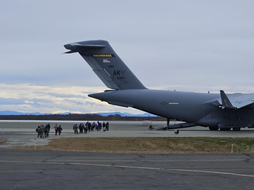 People displaced by ex-Typhoon Halong board a C-17 military transport plane in Bethel to be evacuated to Anchorage on Oct. 15, 2025.