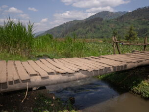In the past, communities separated by a river would build a makeshift bridge of logs. But spring rains would make them slippery and sometimes wash them away.