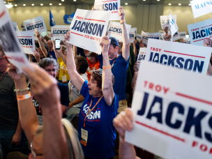 Delegates cheer for Jackson after he secured his party's nomination for Senate.