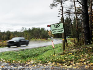 A motorist drives past a