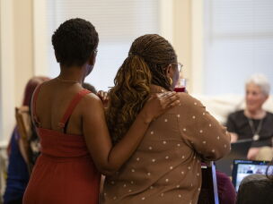 Funmilayo Erinfolami, left, listens to the virtual gathering of former residents and friends of Anne Montgomery House at the goodbye party.