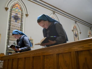 Sister Danielle Lussier and Sister Theresa Aletheia sing morning prayers in the chapel next to their home in Mt. Sterling, Ky., in April.